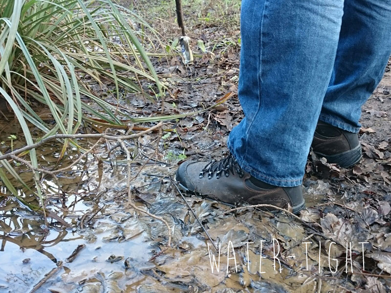 Retrieving an old can with a stick. HiTec boots coping with a marshy puddle.